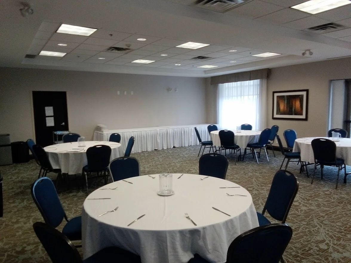 Banquet-style event room setup with round tables